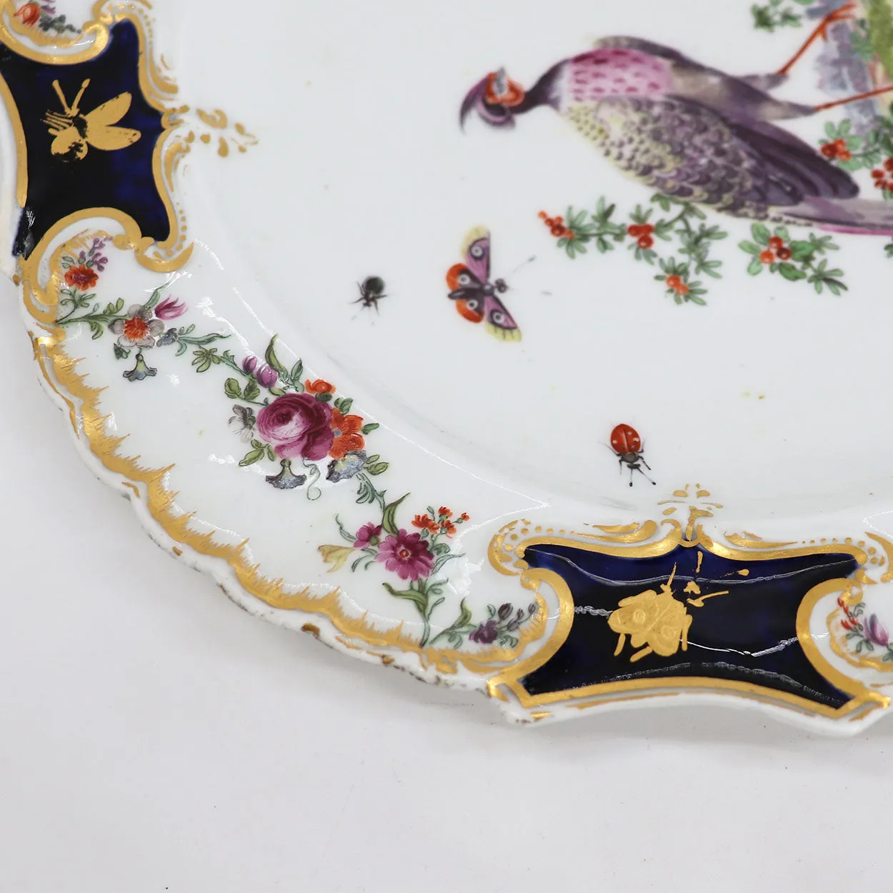 English Chelsea Soft Paste Porcelain Exotic Bird Gilt and Mazarine-Blue Mecklenberg-Strelitz Type Plate